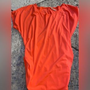 Pretty pink/coral shirt! Side of the shirt seems to be cinched!